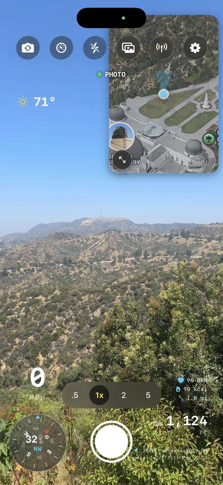 AtlasCam camera screen overlooking the Hollywood hills with live telemetry overlays and zoom controls