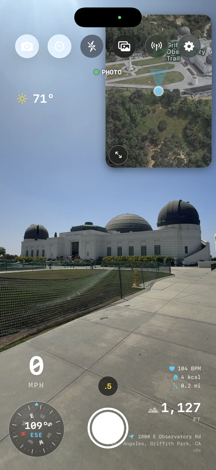 AtlasCam camera view at Griffith Observatory with weather, map, speed, and Apple Watch metrics overlaid